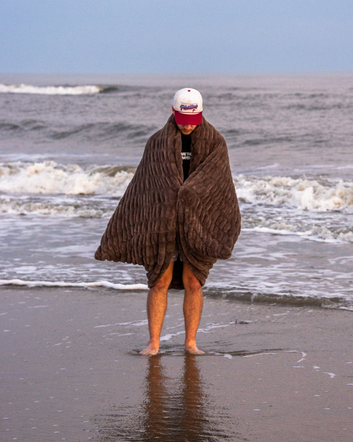 The Be Still Blanket on the beach