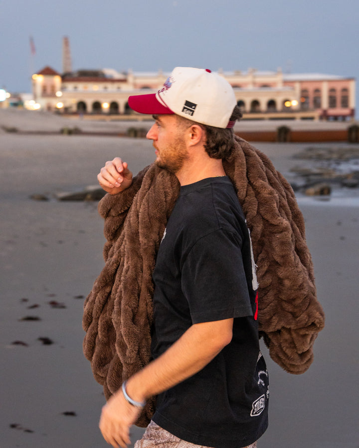 The Be Still Blanket on the beach