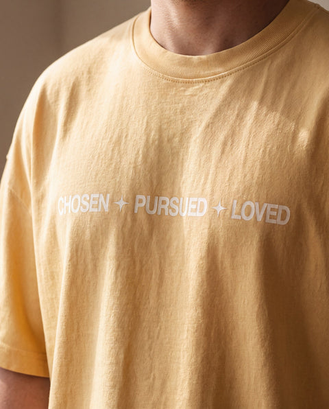 Detail of the chest print as worn, showing the print sitting flush with the cotton knit