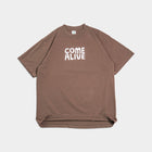Brown oversized tee with 'COME ALIVE' text in white, laid flat on white background
