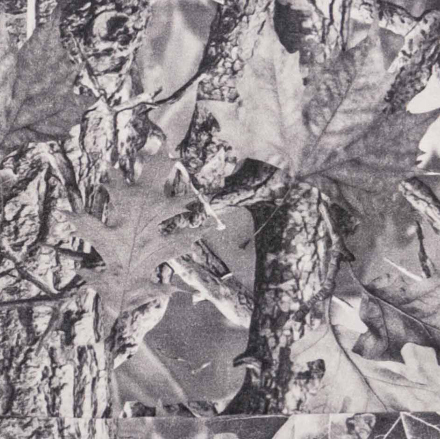 Gray camouflage fabric with realistic leaf and tree bark pattern
