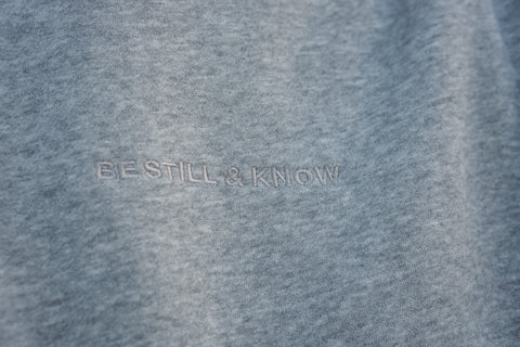 Heather Gray (BE STILL & KNOW) | BE STILL AND KNOW embroidered tone on tone, Brett is 6'1" wearing size M