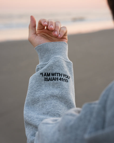 Heather Gray (BE STILL & KNOW) | I AM WITH YOU Isaiah 41:10 sleeve embroidery in black, Brett is 6'1" wearing size M