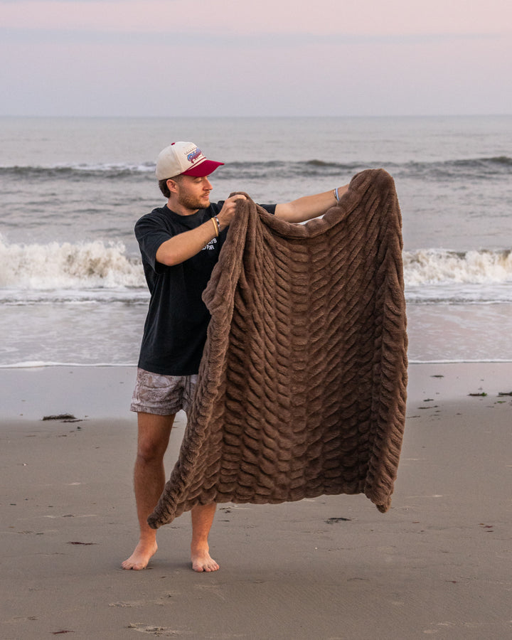 The Be Still Blanket on the beach