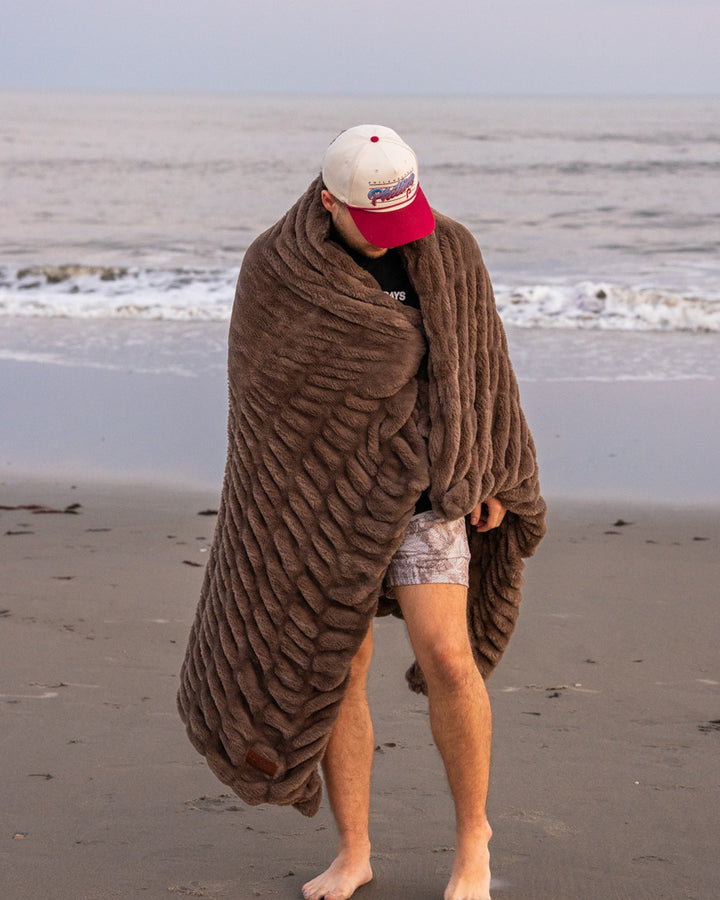 The Be Still Blanket on the beach