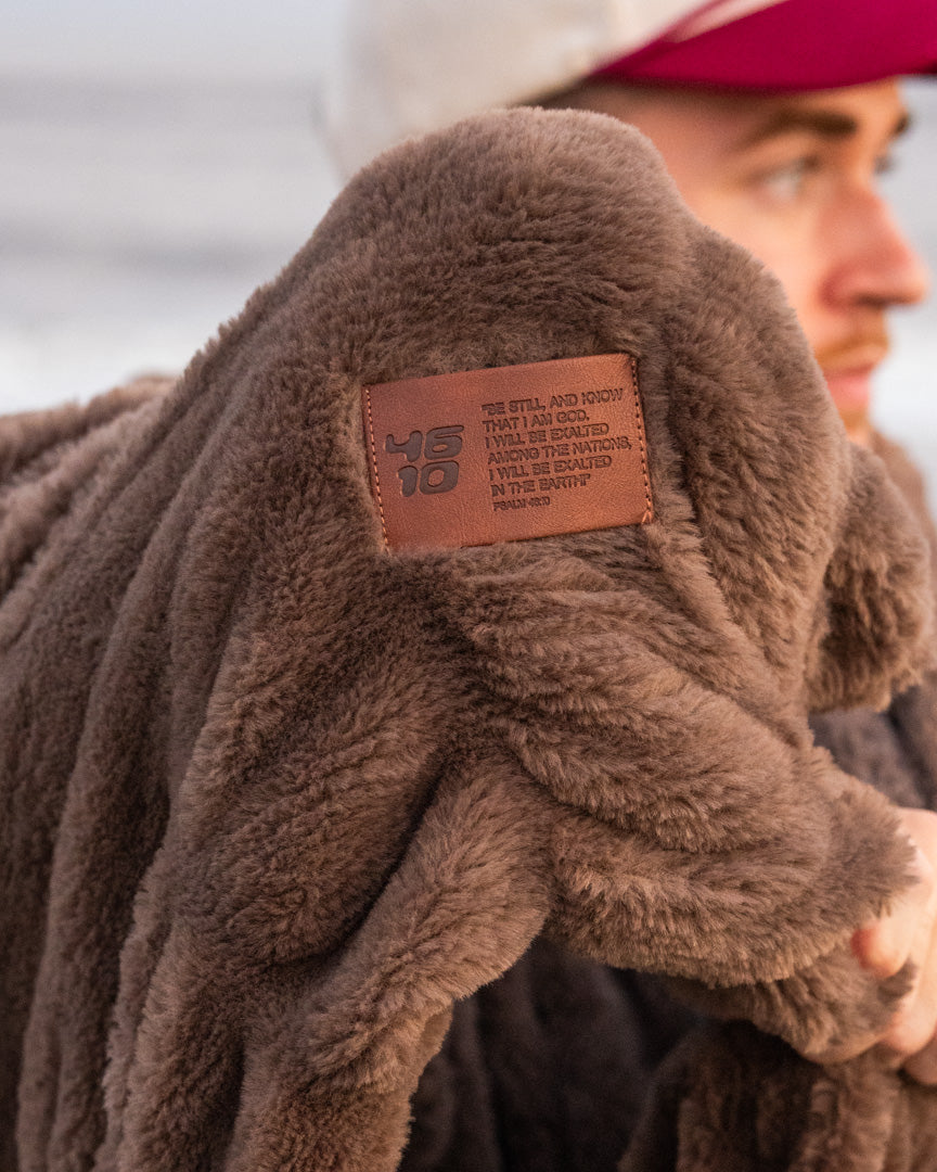 The Psalm 46:10 patch on the Be Still Blanket up close